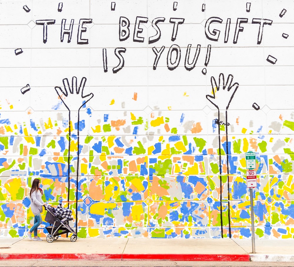 graffiti sign reading 'the best gift is you'